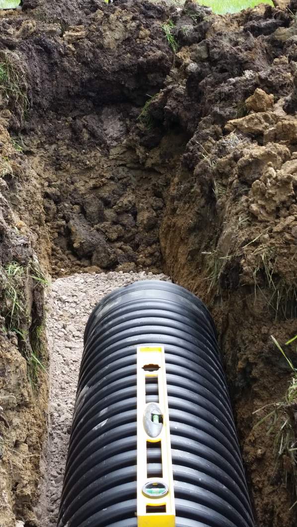 Excavation begins, new drain tile installed