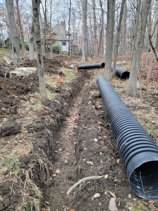 Laying out the corrogated pipe for the drain