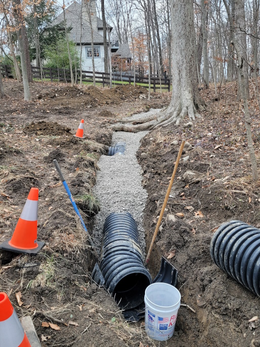 Gravel over the drain tile allows for fast drainage while filtering out debris