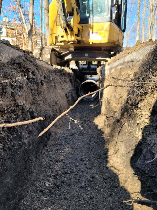 Installing the drain tile in the trench