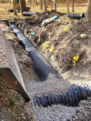 Installing corrugated pipe to drain the yard